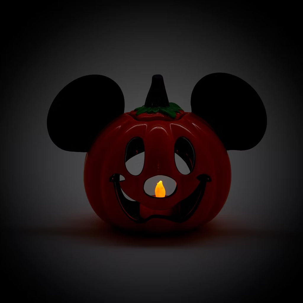 Pumpkin with Mickey Mouse ears on a dark background