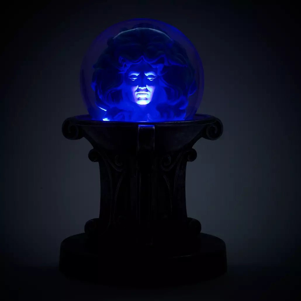 Haunted Mansion Blue glowing crystal ball on a dark background