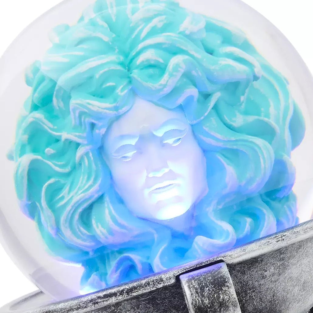 Decorative item with a face design in blue and green on a white background